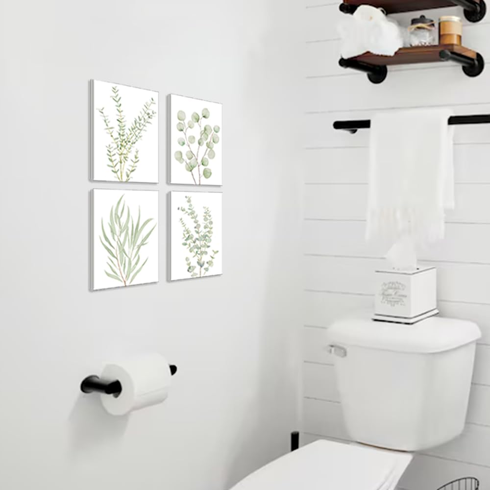 Botanical canvas set in a 2×2 grid in a white bathroom