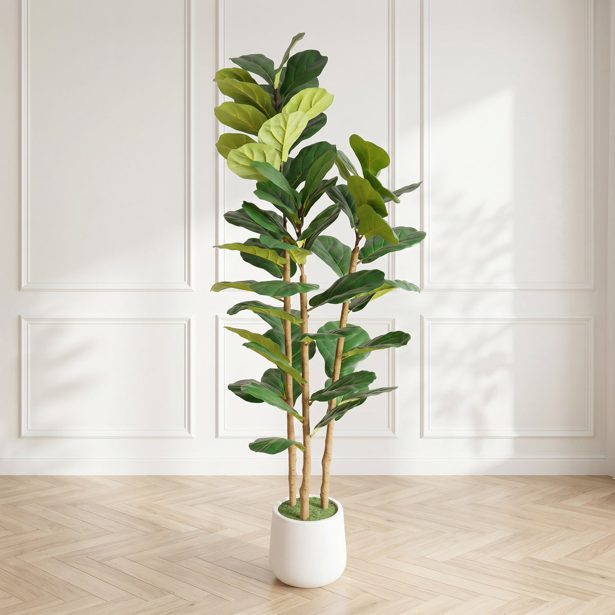 Faux fiddle leaf fig tree in a white pot in a bright paneled room