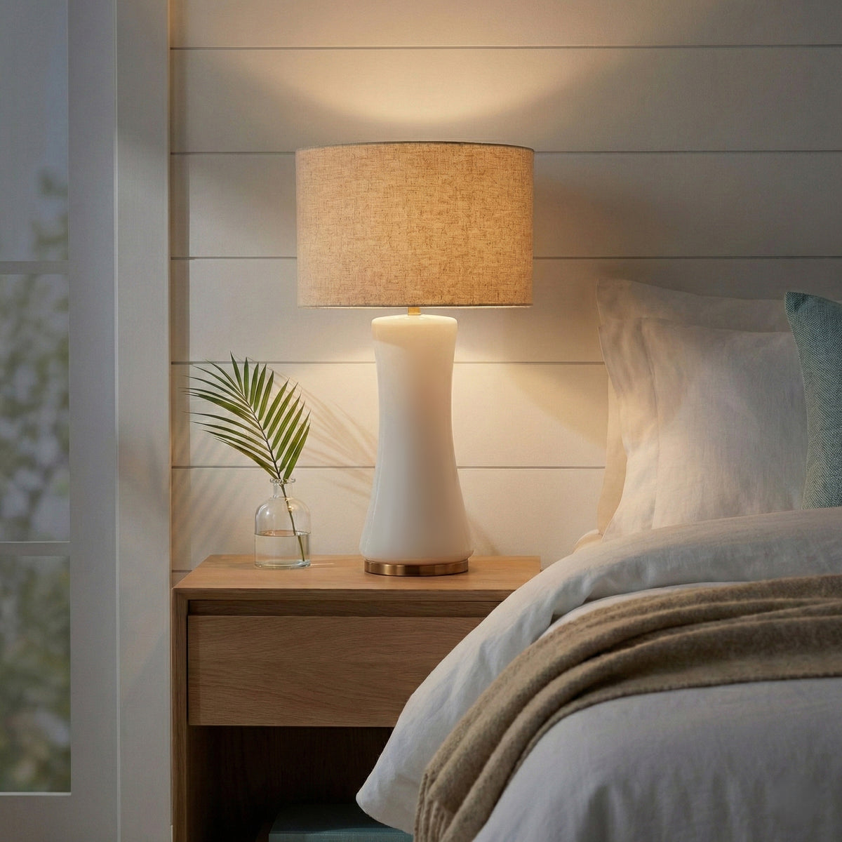 Cascade glass table lamp on a bedside table