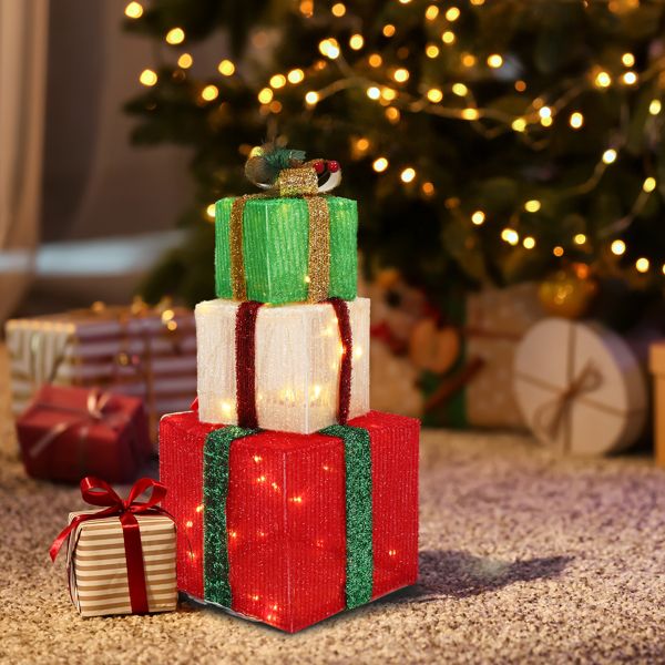 Lighted gift boxes stacked as a glowing tower